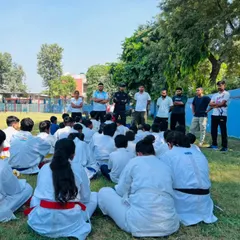 Addressing a group of students during an outdoor seminar. I share my experience and philosophy to motivate the next generation.