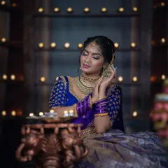 A serene and artistic shot from our Diwali series, with the model surrounded by the warm glow of candles.