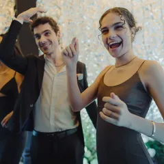 The infectious energy of guests arriving at the Sangeet. I focus on capturing these candid moments of excitement and happiness against the backdrop of shimmering, glamorous decor.