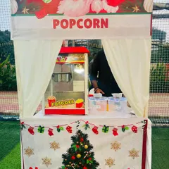 Our festive popcorn stall, fully decorated for a Christmas event. We love customizing our setups to match your party's theme perfectly.