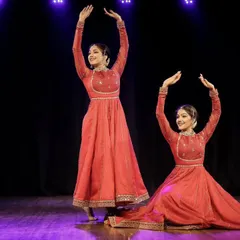 A moment of perfect symmetry in our Kathak duet. This pose, with arms raised in unison, highlights the precise coordination and shared understanding that comes from years of dancing together.