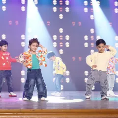 A candid moment of our toddlers on stage, each showing their unique personality. Our goal is to make their first performance experience positive and fun.