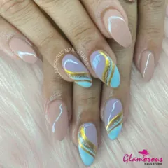 A sophisticated abstract design combining a nude base with swirls of pastel blue, lilac, and gold glitter for a soft yet glamorous look.