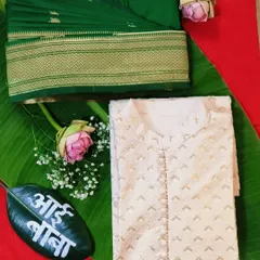 The complete look for the parents-to-be. Here is the pre-pleated green saree alongside the matching men's kurta, ready for a special baby shower celebration.