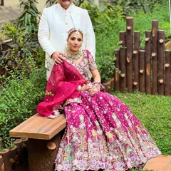 A full view of the couple, with the bride wearing a gorgeous rental jewellery set that perfectly complements her outfit.