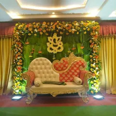 I love using natural elements, and this baby shower backdrop is a perfect example. I used fresh banana leaves as the base, framed with vibrant marigold and chrysanthemum garlands, and added a Ganesha motif made of flowers for blessings.