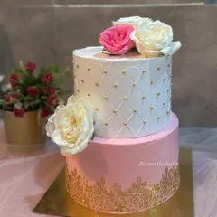 I believe every wedding deserves a stunning cake. This two-tier beauty features a classic white quilted design with gold pearls, a delicate gold lace pattern on the pink bottom tier, and is finished with beautiful fresh roses. It’s a timeless choice for a Nikkah or engagement.