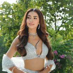 A portrait showcasing the stunning diamond necklace. I chose this piece to elevate the shimmering ice-blue lehenga, making it perfect for an evening reception.