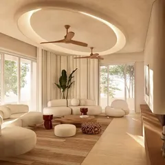 An alternate view of the Kumo House living room, highlighting the curved sofas and the interplay of light from the large windows. Every element is chosen to contribute to a sense of harmony and comfort.