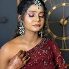 A close-up of the eye makeup from our dusky tone engagement look. You can see the seamless blend of shimmery pinks and the defined lash line, techniques we practice to create depth and dimension.