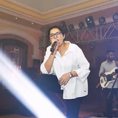 Dhruvi owning the stage during a performance for a corporate client. Our job is to elevate the event's atmosphere and leave a lasting impression.