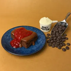 This is how I pack 18g of protein into a dessert. My Chocolate Berry cake bar is made with real whey protein and topped with a rich chocolate ganache and berry compote. It's the perfect zero-sugar, grain-free treat to help you meet your fitness goals.