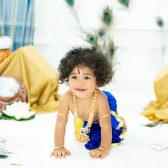 I absolutely adore creating these timeless Little Krishna portraits. This little boy, with his beautiful curly hair and sweet smile, looks divine against the backdrop of peacock feathers, capturing the spirit of Krishna Janmashtami.