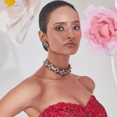 For this campaign, I styled a striking red embroidered corset top with a modern emerald choker. The look is a celebration of bold femininity and intricate craftsmanship.