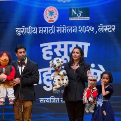 This is what my family's legacy looks like on stage. Performing with my wife Rujuta and our daughter Neeva, the fourth generation of Padhye puppeteers, at the European Marathi Sammelan in Leicester. We bring a century of art and laughter to every show.