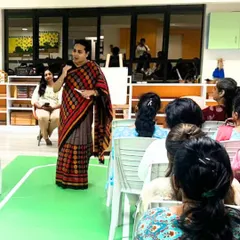 A teacher speaks during a training session, demonstrating our commitment to continuous improvement and reflective teaching.