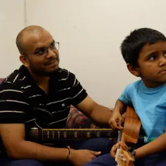 The journey starts here. A snapshot from a one-on-one guitar lesson, where our experienced teachers provide personalized guidance to students of all ages. We focus on nurturing each student's individual style in a warm, supportive environment.