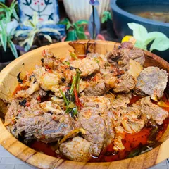 I love making this beef curry. It's cooked slowly with bamboo shoot and special Naga herbs from my garden until the meat is falling apart. The wooden bowl just makes it feel more like home.