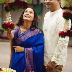 A candid moment at the vibrant flower market. The couple's traditional attire adds a layer of cultural beauty to this spontaneous shot.