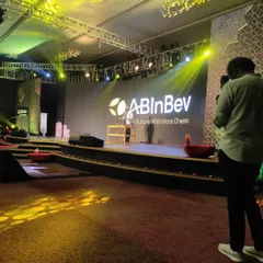A wide shot of the impressive stage setup for the ABInBev Diwali event at Hilton Bangalore. I ensure my performance complements the scale and branding of your corporate function.