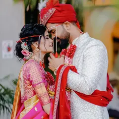 A romantic close-up of the couple on their wedding day. The groom's touch and the bride's loving gaze make this a perfect portrait.