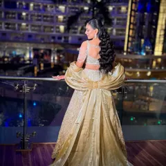 For a grand sangeet night, I created this full glam look. The focus was on creating a royal and impactful style that felt like a true Bollywood moment, complete with a dramatic gown and sparkling diamond jewelry.