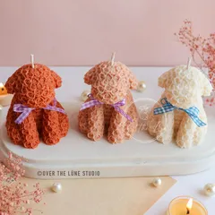 My Rose Puppy candles, made from intricately detailed rose-shaped wax. They come with a little ribbon and are available in several colors.