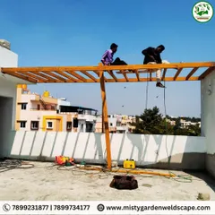 Strong foundations make stunning terraces. My team is at work on a metal frame structure, demonstrating the skill and teamwork required to build a safe and long-lasting pergola.