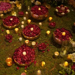 Romantic details for a garden wedding. Brass bowls filled with rose petals and floating candles create a beautiful and intimate ambiance, especially for an evening event.