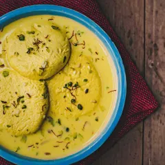 Our creamy Rasmalai is a must-try. Soft cottage cheese discs are soaked in thickened, sweetened milk, flavoured with saffron and cardamom, and garnished with pistachios.