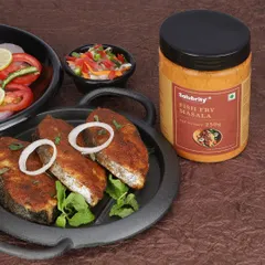 We style and shoot appetizing food photography that makes your product the hero, as seen in this shot for a fish fry masala, complete with fresh ingredients and a perfectly cooked dish.