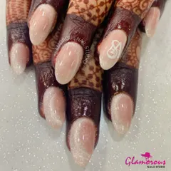 Personalize your bridal look with a special touch. These elegant, shimmery cat-eye effect nails are finished with a delicate, hand-painted initial. It's a subtle yet meaningful way to make your wedding day manicure uniquely yours.