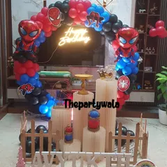 Your friendly neighborhood Spiderman is here! This action-packed setup features a massive red, blue, and black balloon arch, Spiderman cutouts, and a cool "Happy Birthday" neon sign that really makes the whole thing pop. It's a super choice for any little hero's birthday bash.