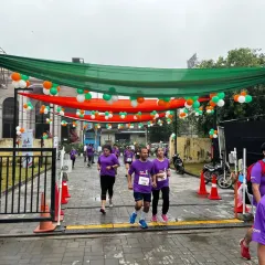 Runners at the DLF Freedom Run make their way through a course decorated in the national colors. I ensure every event has a professional and festive atmosphere, from the track setup to the branding.