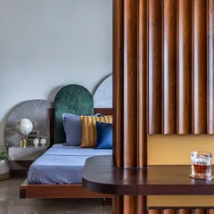 A master suite should be a personal sanctuary. For this Mumbai home, I designed a space where unique forms and textures meet effortless calm. The custom-arched headboard and thoughtful details create a curated, cozy retreat that whispers relaxation.