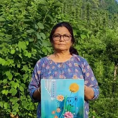 Holding one of my abstract floral paintings during an art camp in Wayanad. Being surrounded by nature provides endless inspiration for new ideas and color palettes.
