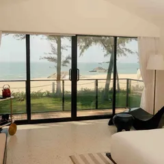 The bedroom at The Postcard Arabian Sea, Maravanthe Beach, opens up to an uninterrupted view of the ocean. This is a secluded, luxury oasis for a perfect coastal retreat.