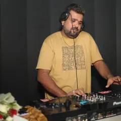 Focused on the mix at Bangtan Lounge in Mira Road. I'm reading the room and lining up the next track to keep the party going.