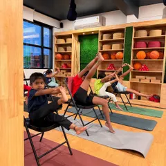 Chair yoga isn't just for adults. Our kids use chairs to work on leg extensions and hip flexibility, making challenging poses more achievable.