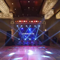A stunning stage and dance floor setup for a ring ceremony. The LED screen with cosmic visuals and dynamic spotlights created an electrifying atmosphere for the evening's celebrations.