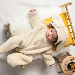 Snuggled up and dreaming. I have a collection of soft, adorable animal outfits, like this fluffy bunny costume, that are perfect for a cozy and cute newborn photo.