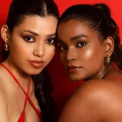 Makeup for me is about telling a story. In this editorial shoot, I used a bold red backdrop to create a powerful contrast, celebrating the beauty of different skin tones side-by-side. The makeup is clean yet fierce, letting the models' expressions shine.