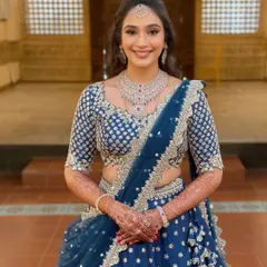 Minimal glam, maximum love. This bride's reception look is all about effortless charm, with soft makeup and a modern hairstyle that lets her natural beauty and happiness shine through.