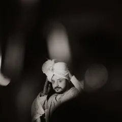 The groom's anticipation is a powerful part of the story. This artistic, black and white portrait of Ananta at Hotel Silver Spoon captures the quiet moments of reflection before he begins his new chapter.