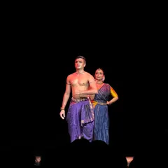 A dramatic still from 'ĀBHA' where lighting plays a crucial role. The stark contrast highlights the emotional weight of the scene, drawing the audience into the story.