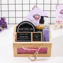 A beautifully arranged Mother's Day hamper in a wooden crate. This set includes my Aloe Vera Gel, Glow Bar soap, Flamingo Pink lip and cheek tint, and Aloe & Lavender hair toner, making it a perfect gift to pamper mom.
