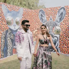 For this 'Afro Jungle Carnival' theme, we created a cool, graphic backdrop with animal prints and quirky art, giving the couple a fun and edgy setting for their photos.