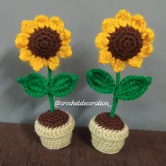 Two of our mini sunflower pots, side-by-side. These small decorative items are one of our bestsellers and can be customized upon request.