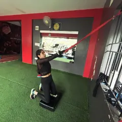 A kneeling anti-rotation press with a band, which builds core stability while simultaneously stretching the hip flexors.