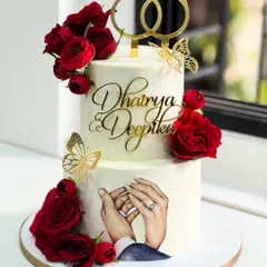 Every love story deserves a sweet beginning. This two-tier engagement cake celebrates a couple's forever with deep red roses, golden butterflies, and a hand-painted portrait of their promise.